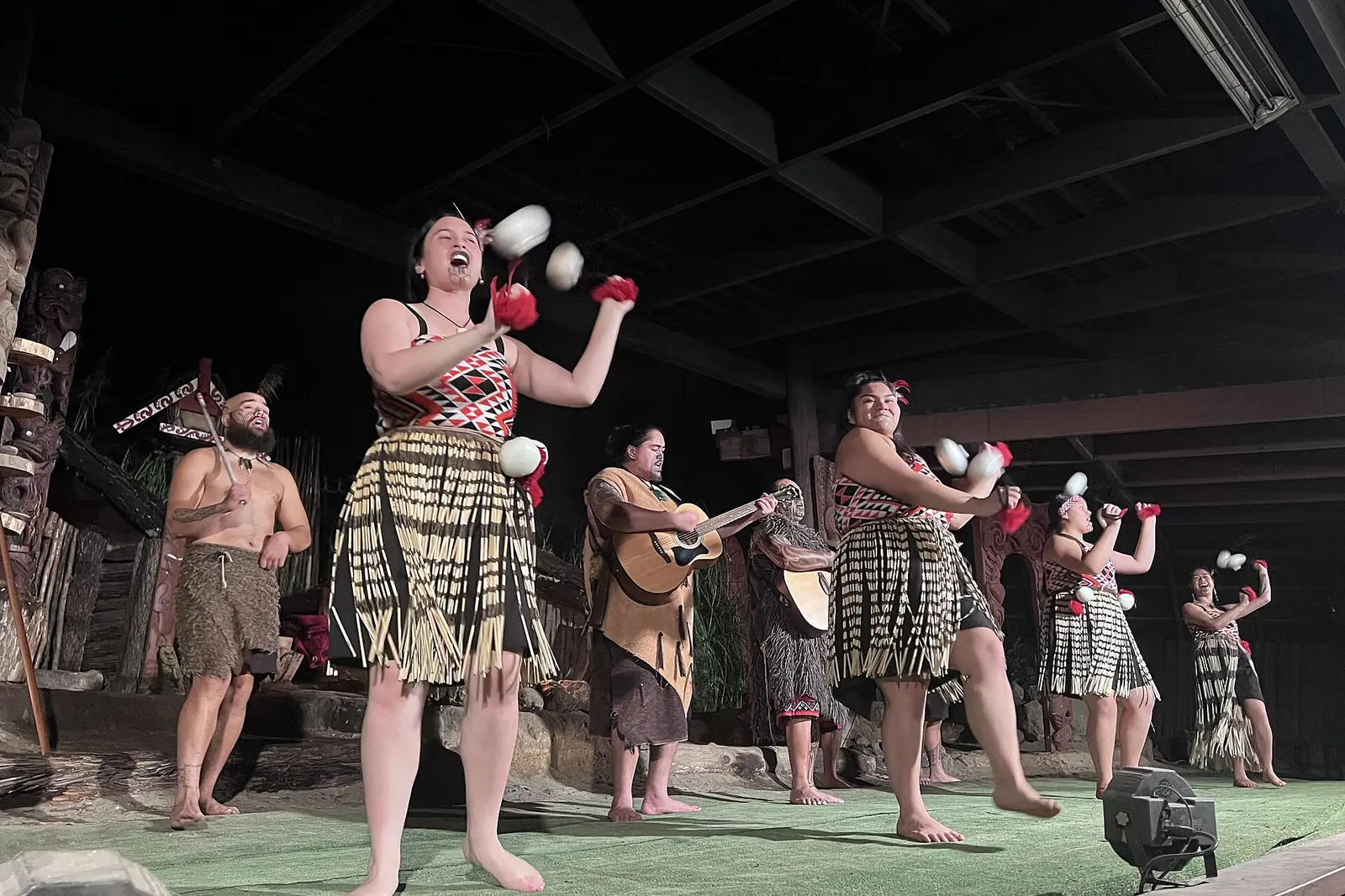 Māori performers with poi at a cultural show in Rotorua, New Zealand