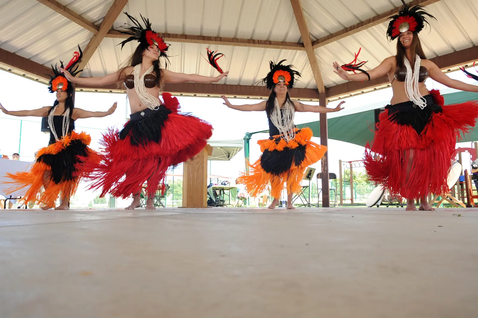 A Polynesian dance group, Manea Porinesia, performing on a stage in Colorado